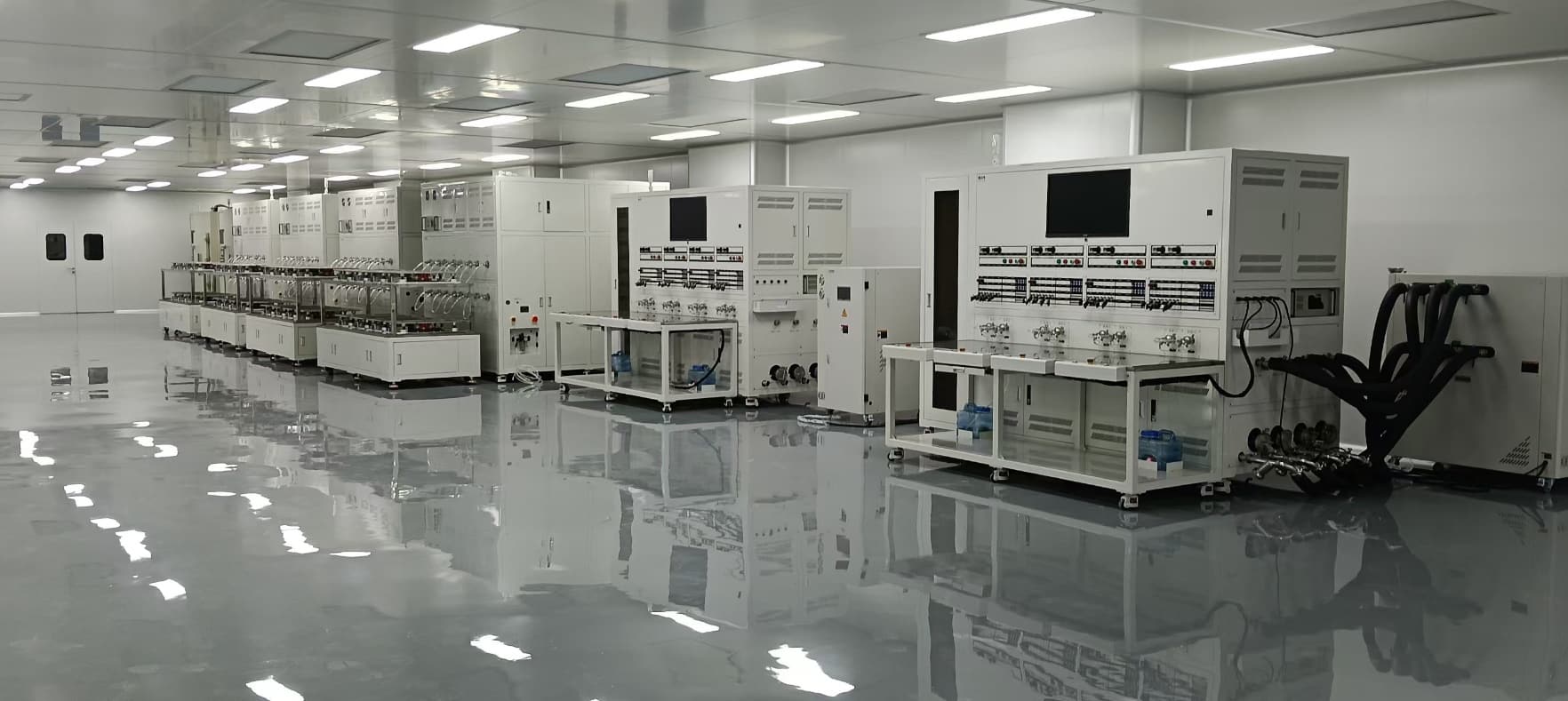 Vacuum sealing and assembly station within a cleanroom environment to ensure dust-free product packaging.